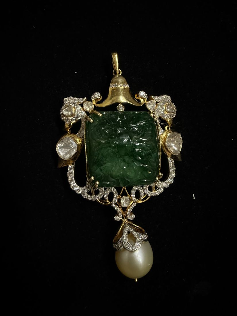 Carved emerald pendant with diamonds and a pearl drop